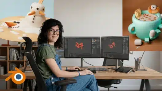 A woman sits at a desk with dual monitors displaying 3D modeling software. On the wall are two 3D art pieces: a melting snowman and a cup of hot chocolate with marshmallows. The Blender logo is in the corner.