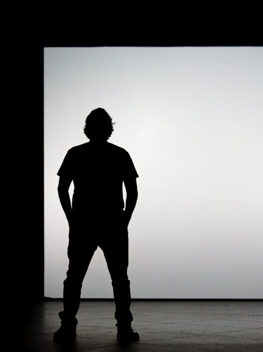 Creator presenting on a bright stage to market an online course