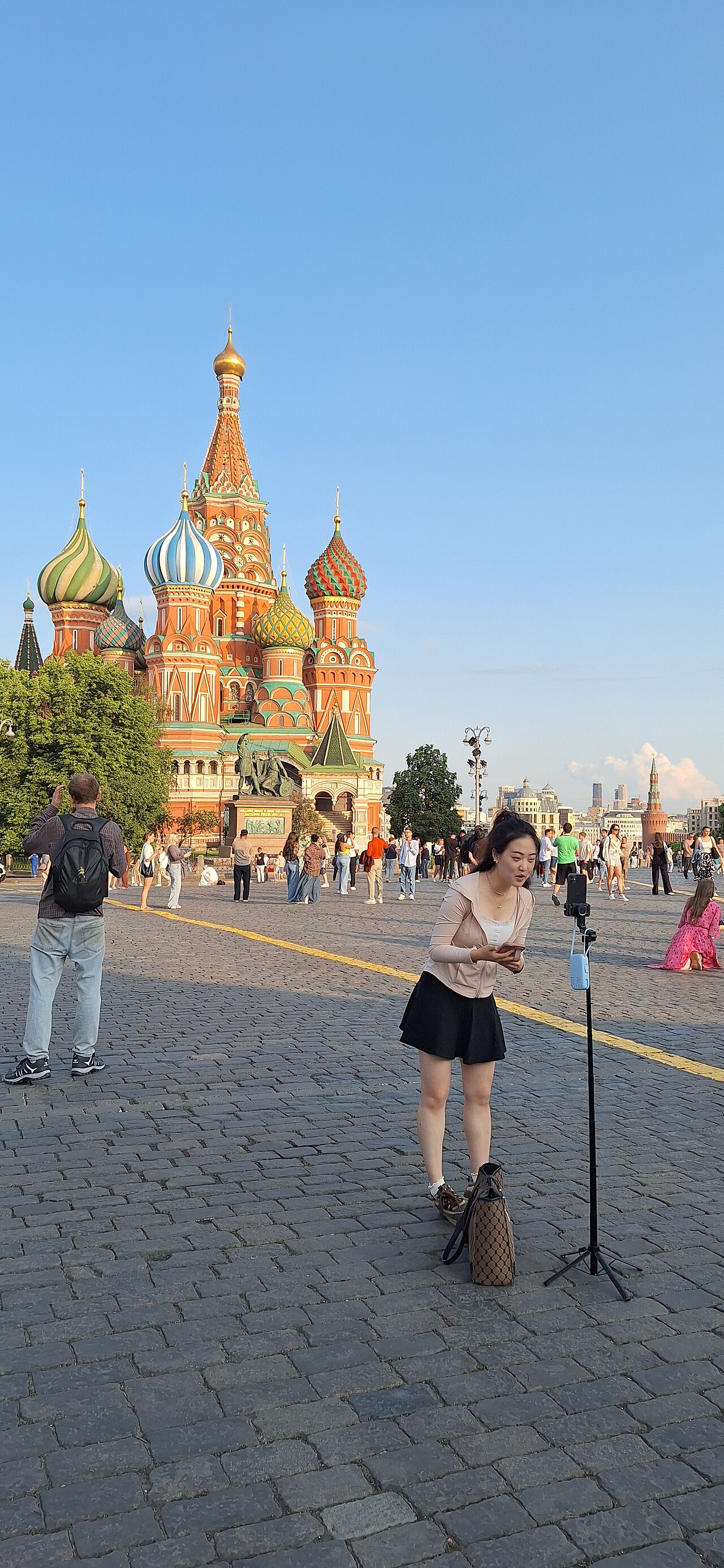 Content creator filming herself outdoors for a social media video