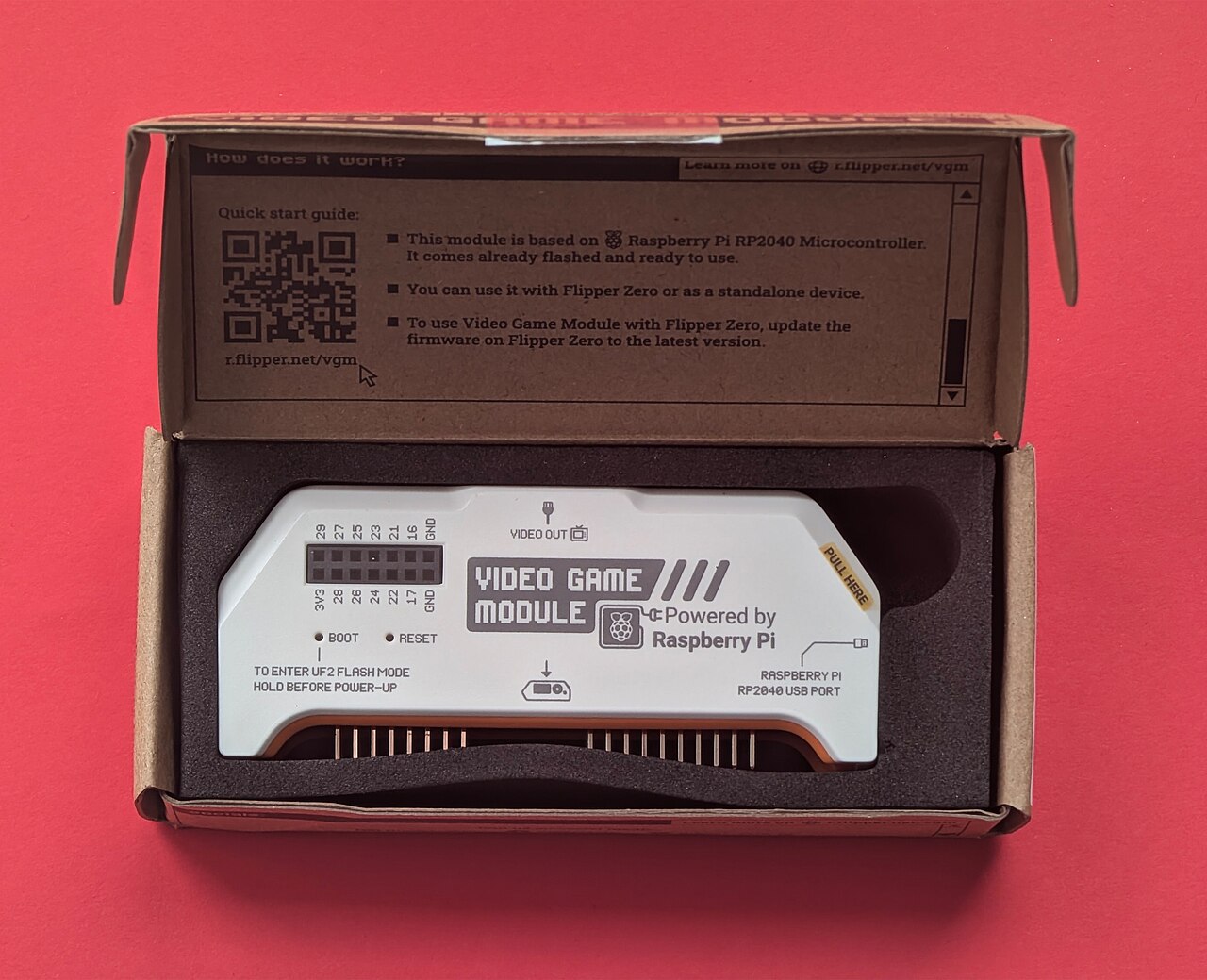 Product unboxing video setup showing tech gadget with packaging