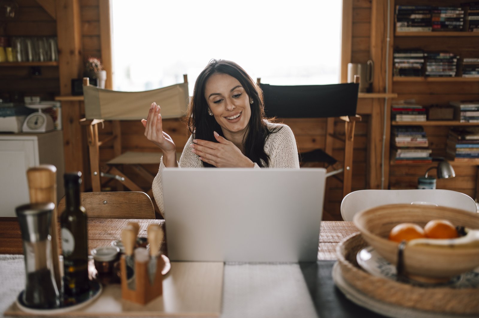 Woman taking an online English lesson on her laptop