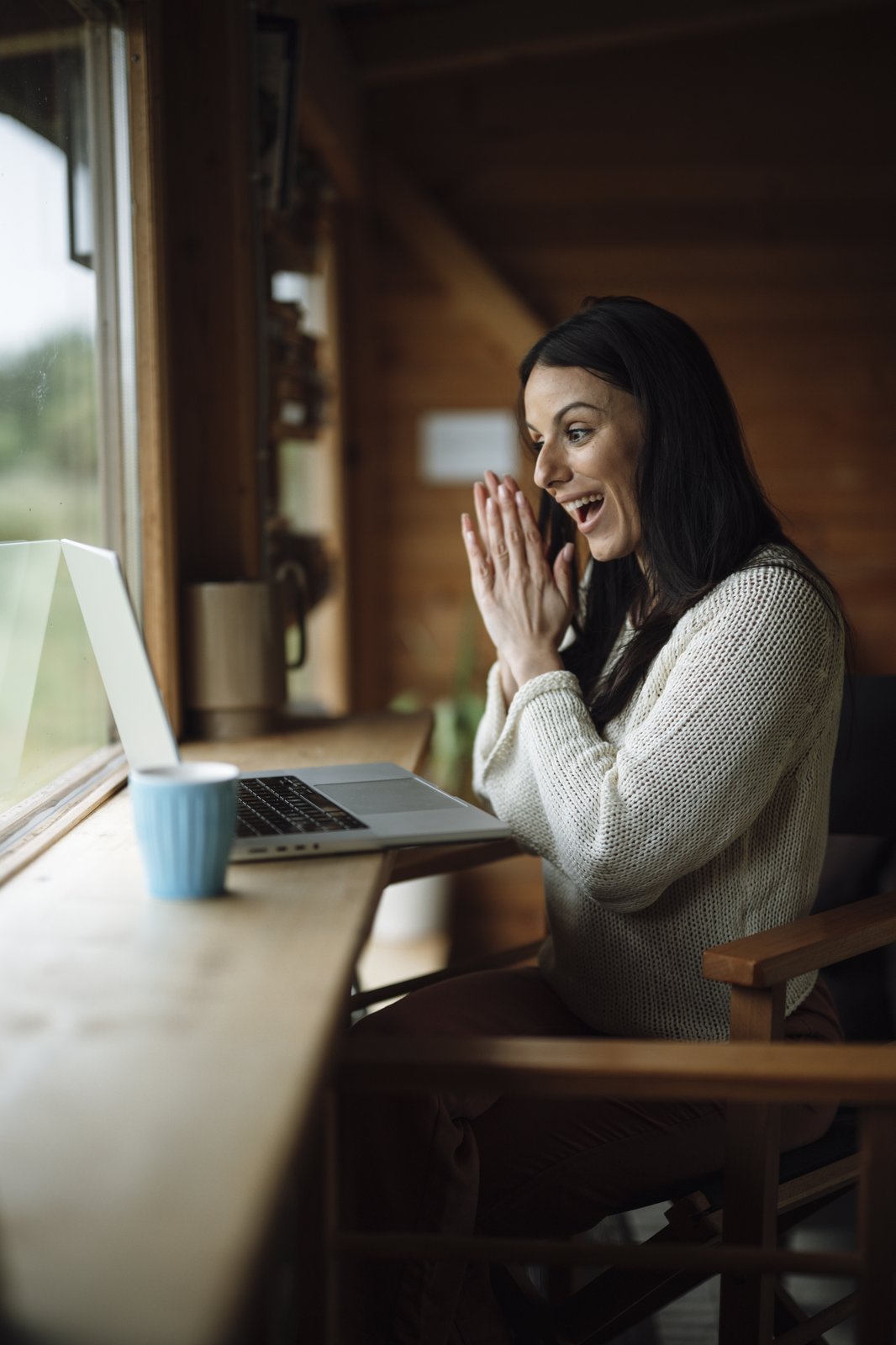 Happy woman learning online from home