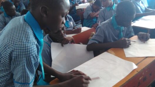 Students making drawings during an art class
