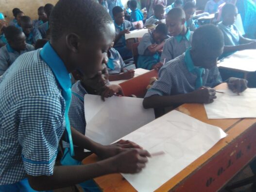 Students making drawings during an art class