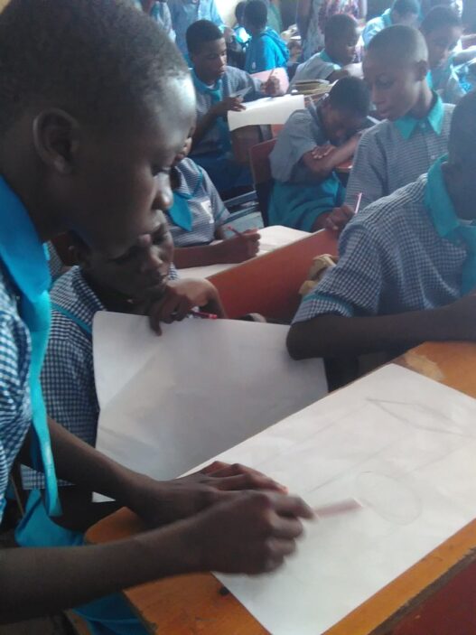 Students making drawings during an art class