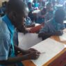 Students making drawings during an art class