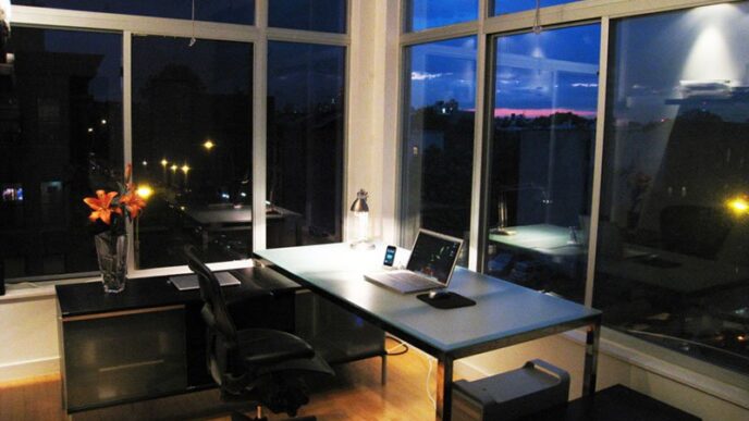 Cozy home office setup with laptop at night