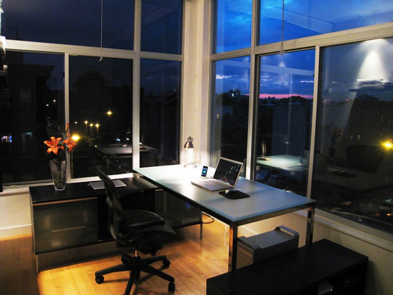 Cozy home office setup with laptop at night