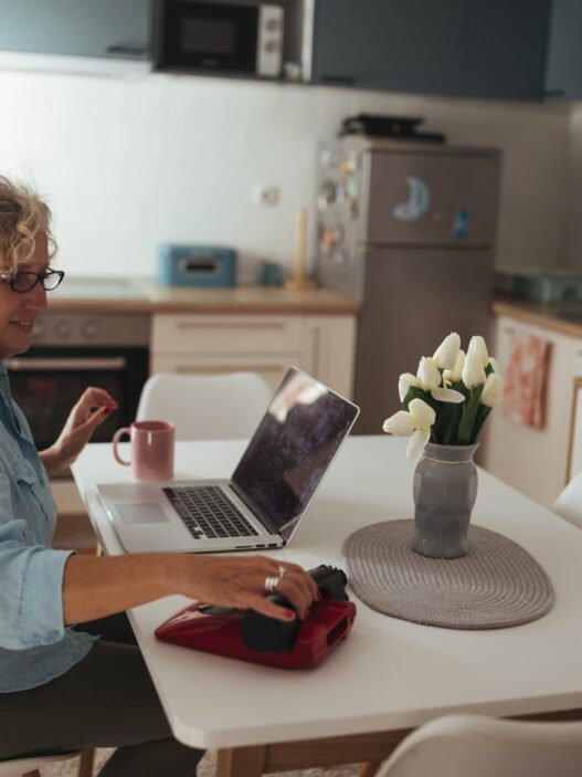 Senior woman learning on a laptop at home