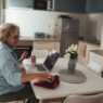 Senior woman learning on a laptop at home