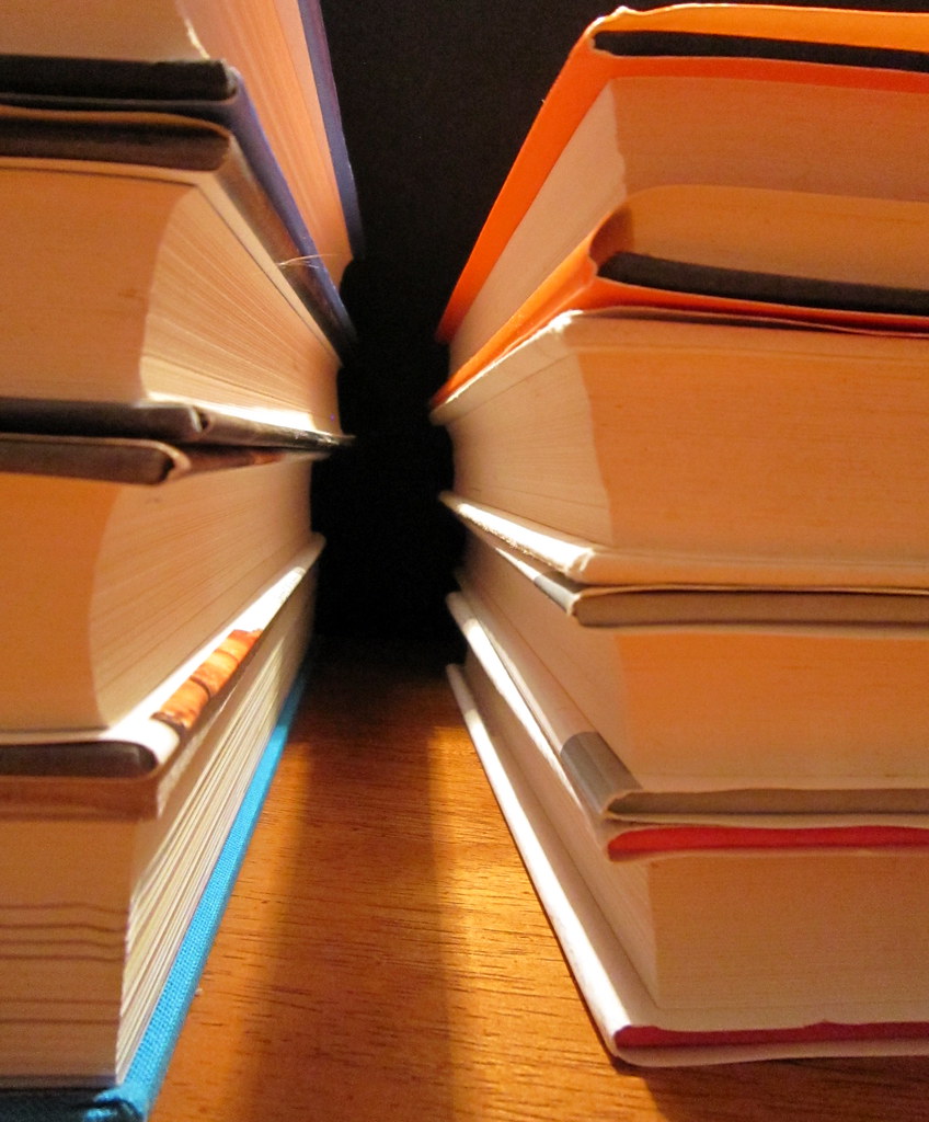 Stack of books with an inspirational quote