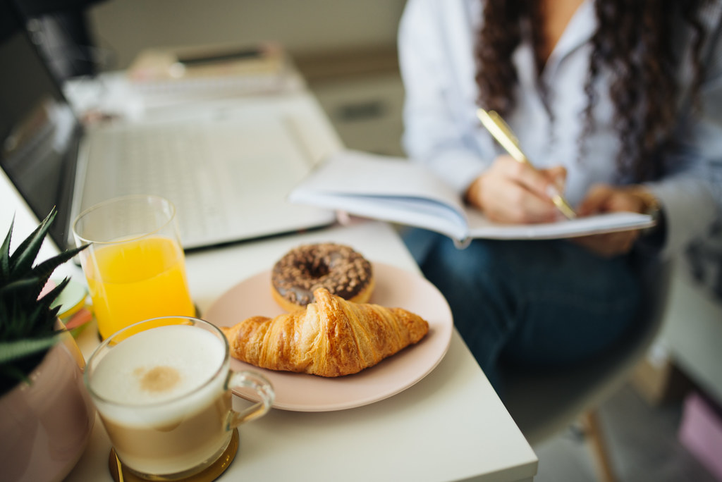 Morning routine with breakfast at a home desk