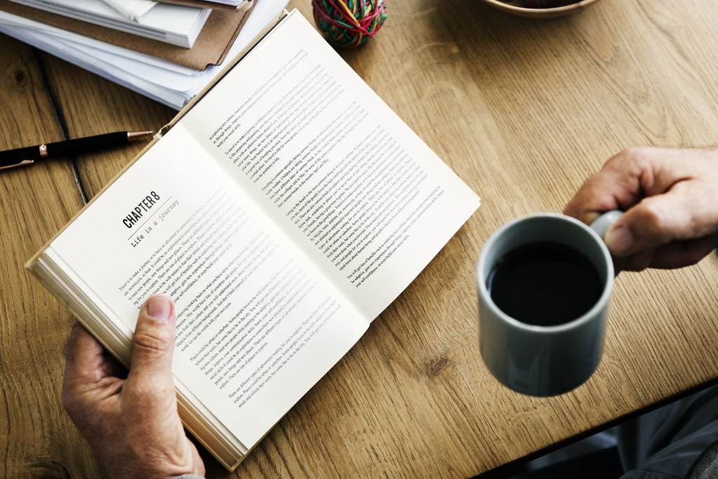 Coffee break while reading a travel book