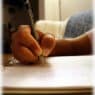 Hand writing with a pen in a spiral notebook