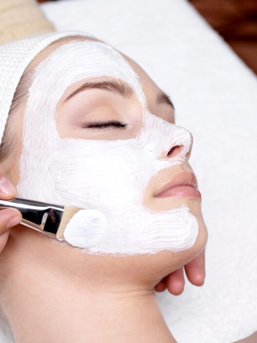 Woman receiving a professional facial treatment at a spa