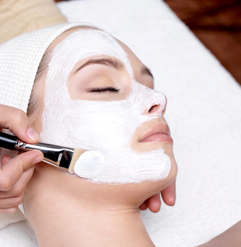 Woman receiving a professional facial treatment at a spa