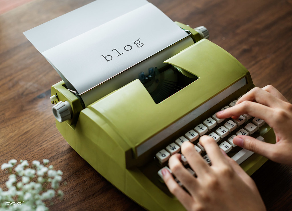 Overhead view of hands typing at a desk
