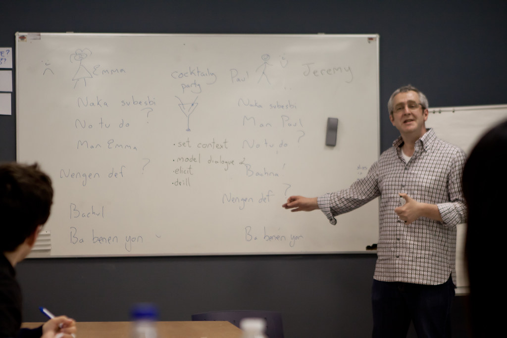 Adults participating in a language teaching workshop