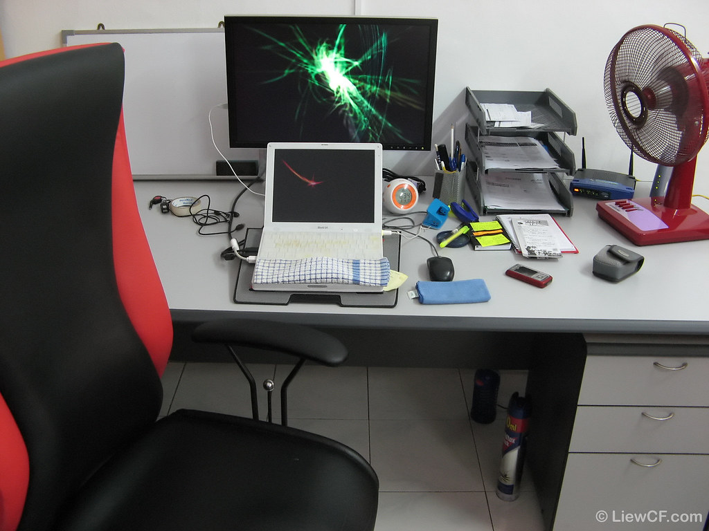 Tidy blogging workspace with laptop and notebook