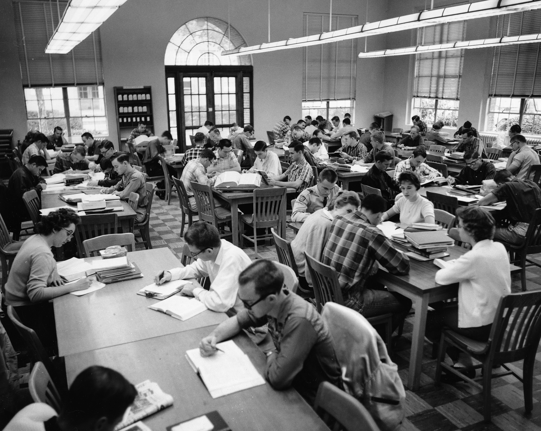 Students studying in a college library