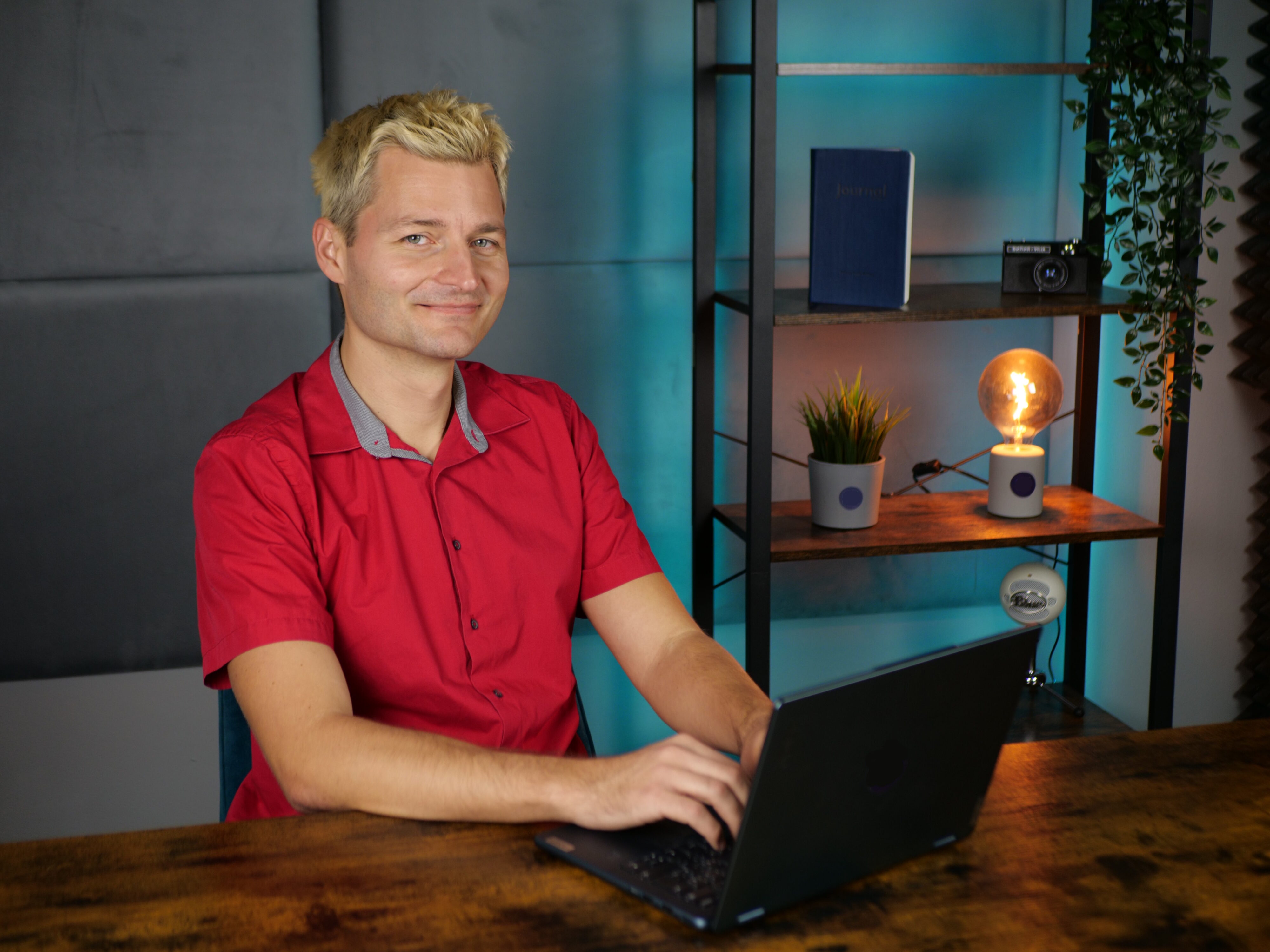Man working on laptop in a studio