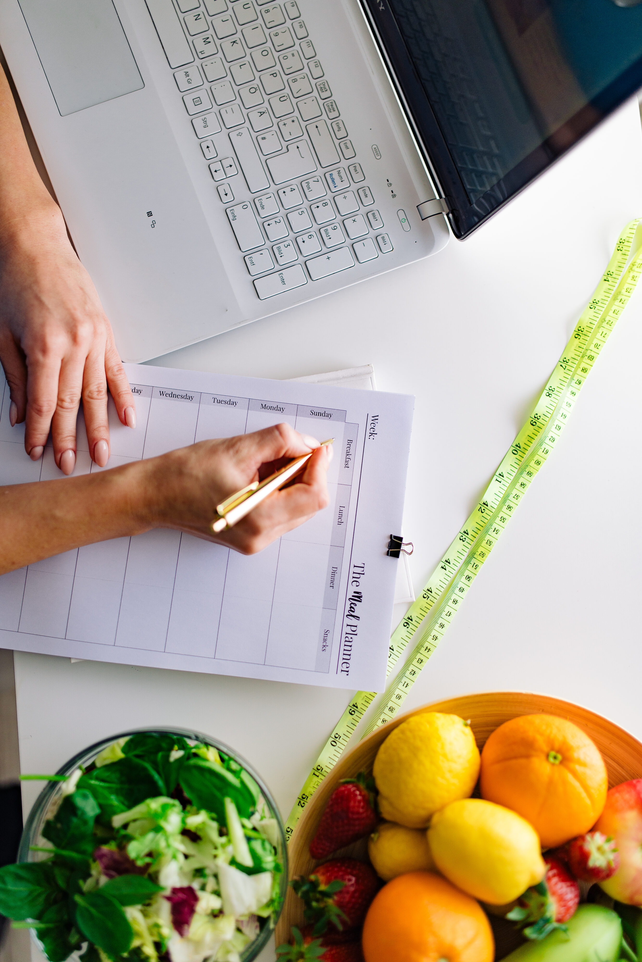 Person writing a list while planning