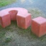 A giant concrete question mark sculpture outdoors