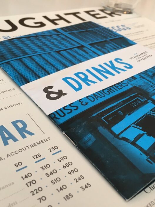 Printed restaurant menu with bold graphic design