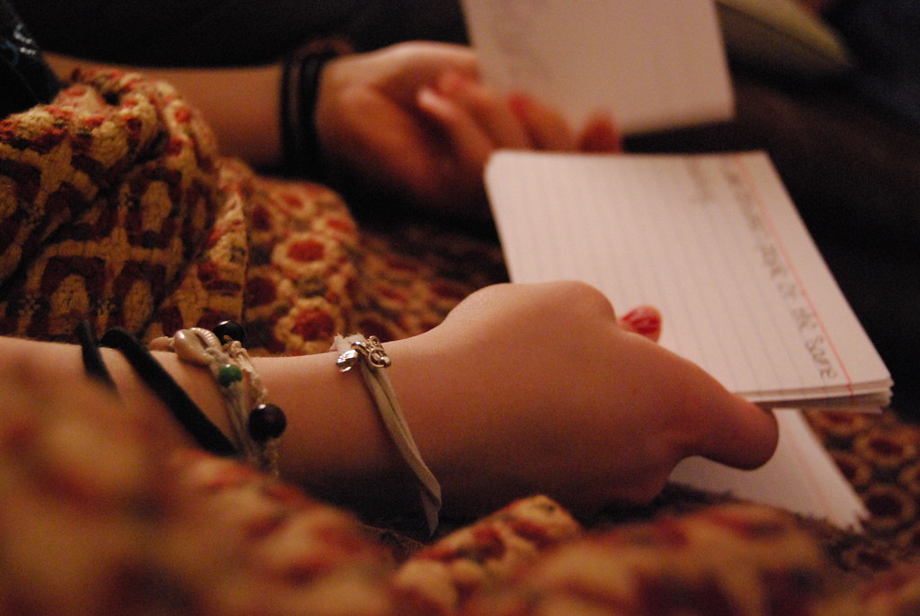 A student studying with books and notes spread out on a desk