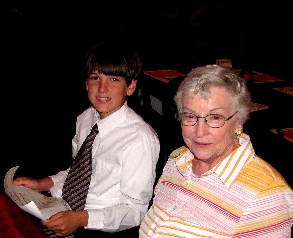 A grandmother and her grandson together, smiling