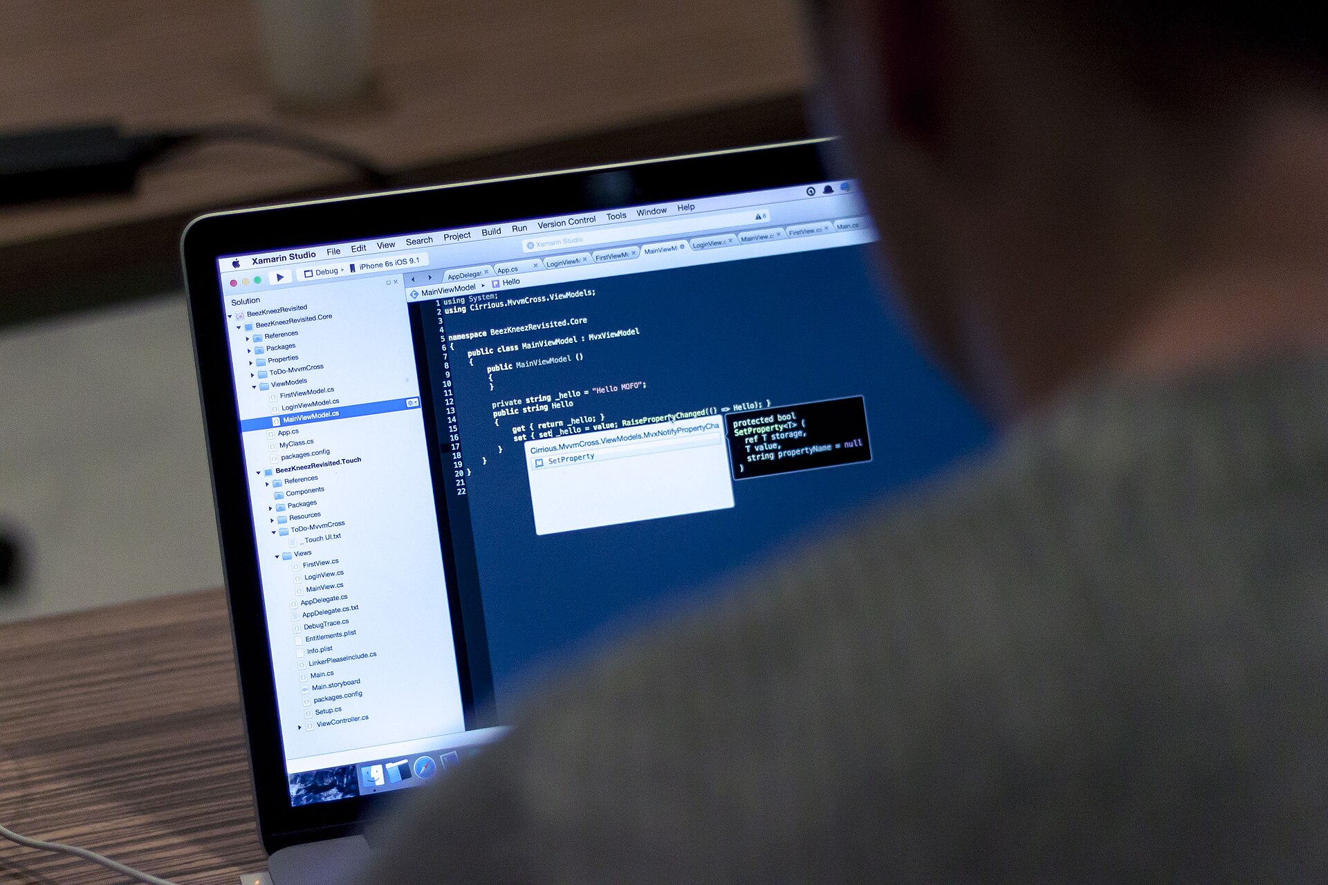 Close-up of a laptop screen showing programming code