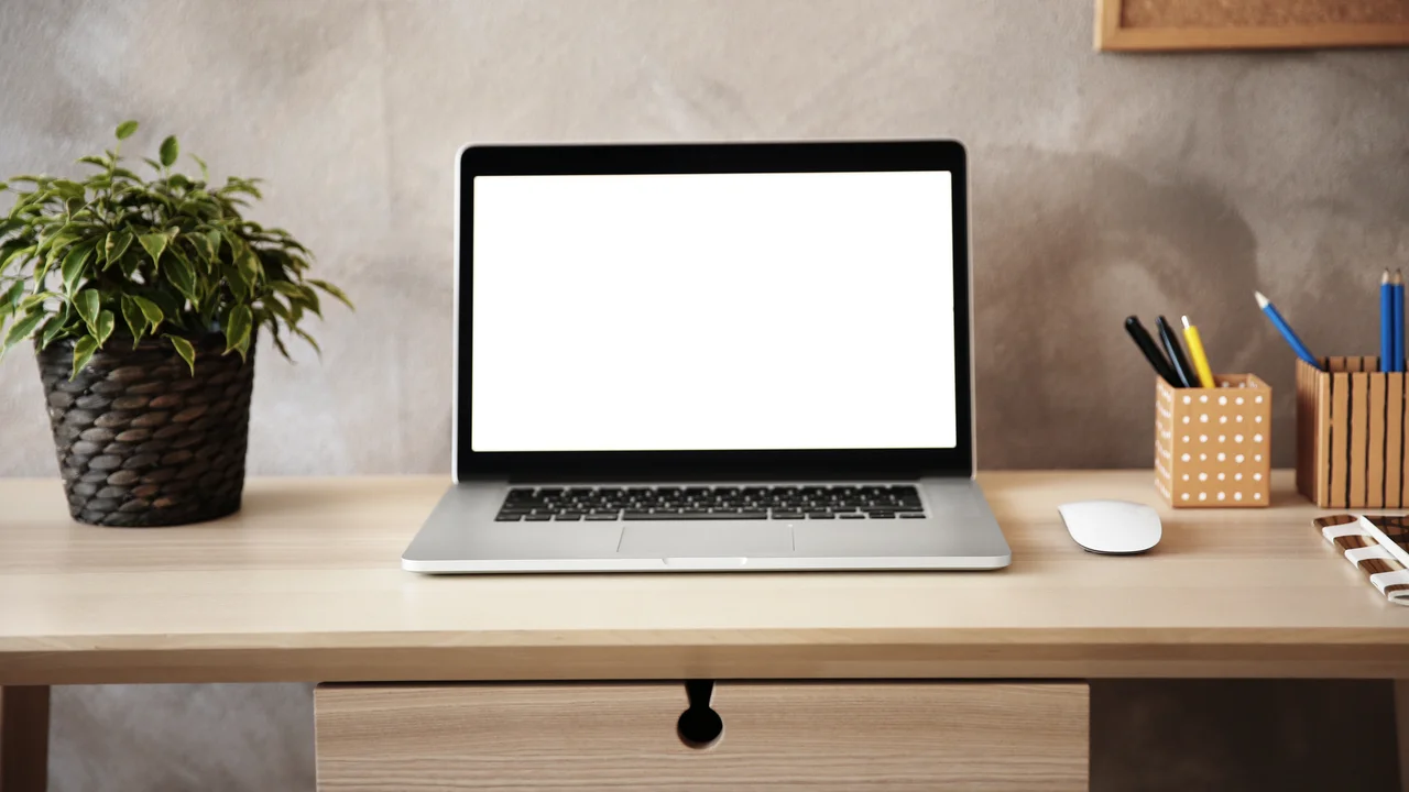 Modern workplace with laptop on table