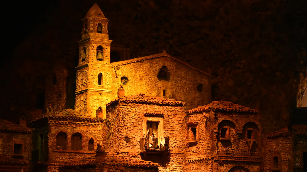 Low angle view of illuminated cathedral against sky at night