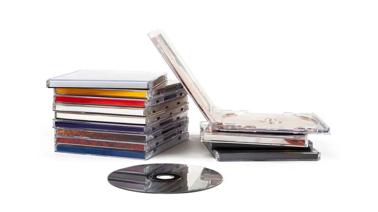 Compact discs over white background